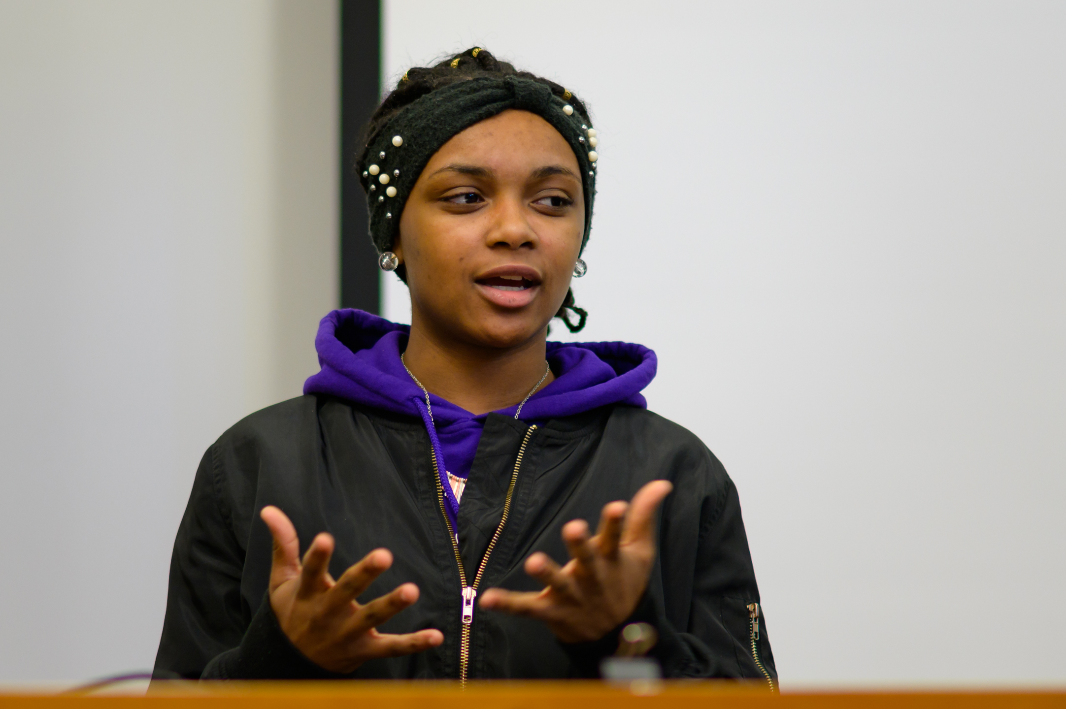 Marshae J., third year Project HEAL student, performs spoken word (Medium close up)