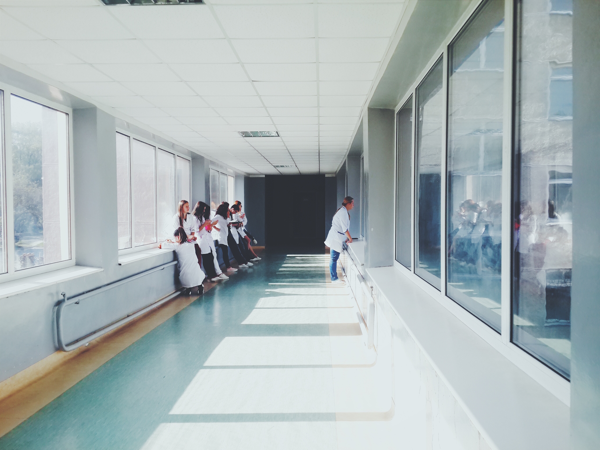 women waiting in hospital corridor