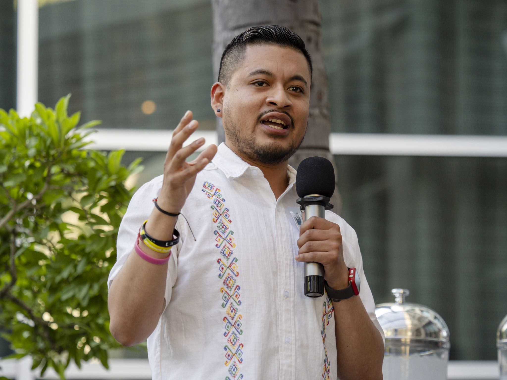 Agustin Angel Bernabe speaks while holding microphone