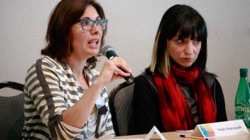 Two-shot of panelists, Felicity Schaffer (L, speaking), Neda Atanasoski (R)