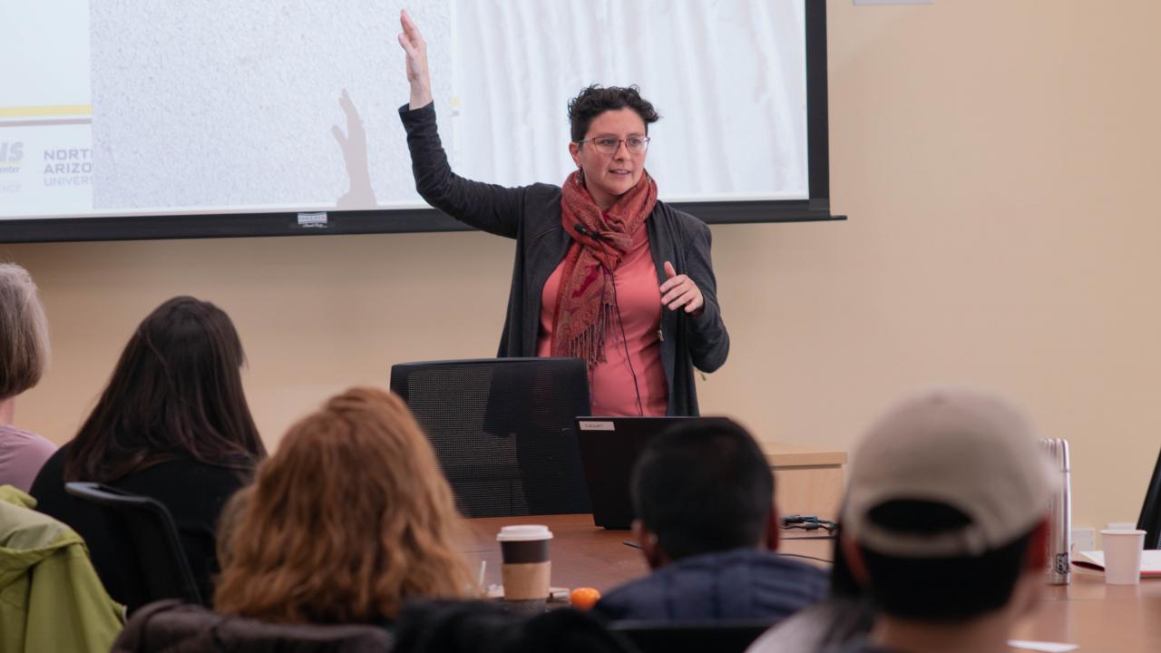 From Seth Karten, "Feminist Research Institute’s Sarah Rebolloso McCullough Discusses Equity & Justice in Bicycle Research, Planning, & Advocacy," METRANS, February 25, 2019. Medium long shot of Dr. Sarah McCullough lecturing at seminar