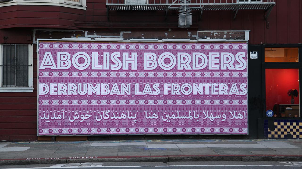 Gilda Posada Abolish Borders/ Derrumbe las fronteras / اهلا وسهلا بالمسلمین هنا / پناهندگان خوش آمدید , 2017, vinyl billboard. Courtesy of the artist. Photo: Gilda Posada