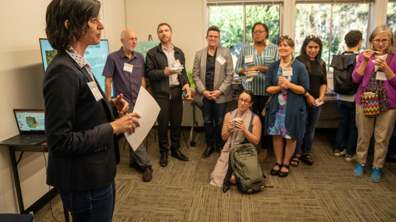 Dr. Kalindi Vora addresses a crowd at FRI in 2019