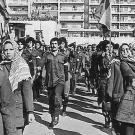 Black and white photo of Fateh Militia marching