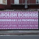 Gilda Posada Abolish  Borders/ Derrumbe las fronteras / اهلا وسهلا بالمسلمین هنا / پناهندگان خوش آمدید , 2017, vinyl billboard. Courtesy of the artist. Photo: Gilda Posada