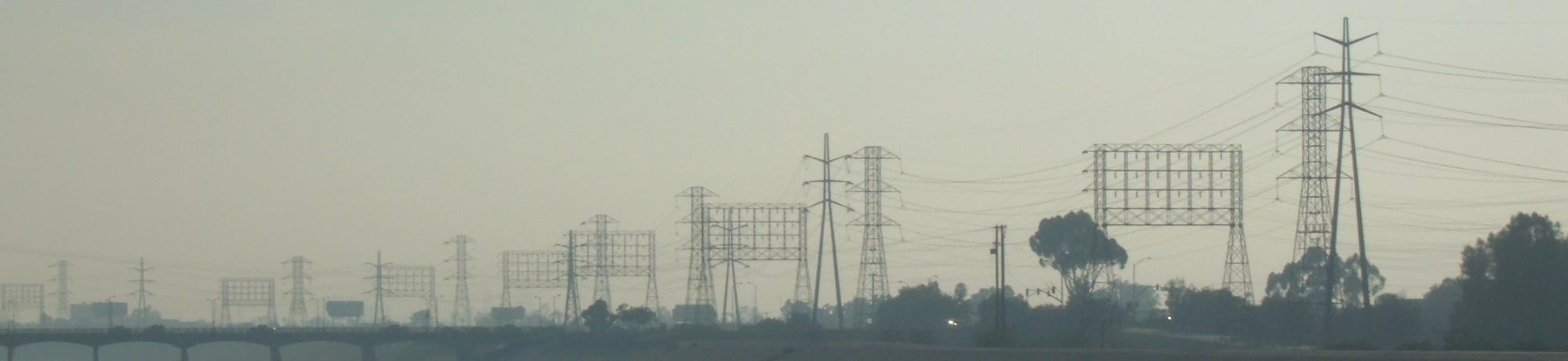 LA river surrounded by concrete, bike paths, streets, and power lines