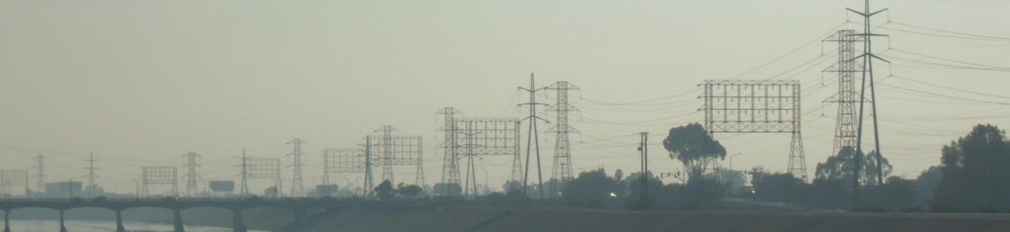 LA river surrounded by concrete, bike paths, streets, and power lines